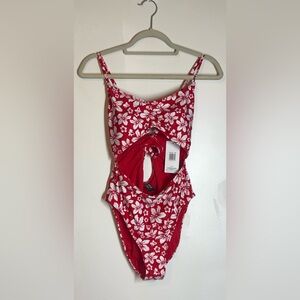 Hurley red and white floral patterned cut-out one-piece swimsuit.